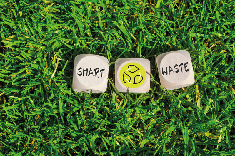 Cubes and dice in the green grass with zero waste and recycling